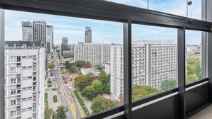 A high-rise building with a view of a cityscape through large windows. - Lumina 15th Floor Apartment in Warsaw  (Warsaw)