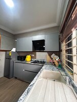 Fridge, microwave, stovetop, cookware/dishes/utensils