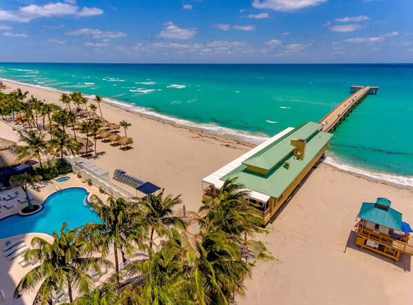 On the beach, sun loungers, beach towels