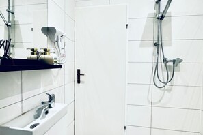 Shower, hair dryer, towels, soap