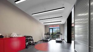 A gym with treadmills, dumbbells, and a red cabinet. - Mercure Beijing The Grand Canal Cbd (Tongzhou)