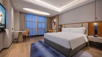 Executive-rum - 1 kingsize-sÀng | DuntÀcken, minibar och vÀrdeförvaringsskÄp pÄ rummet