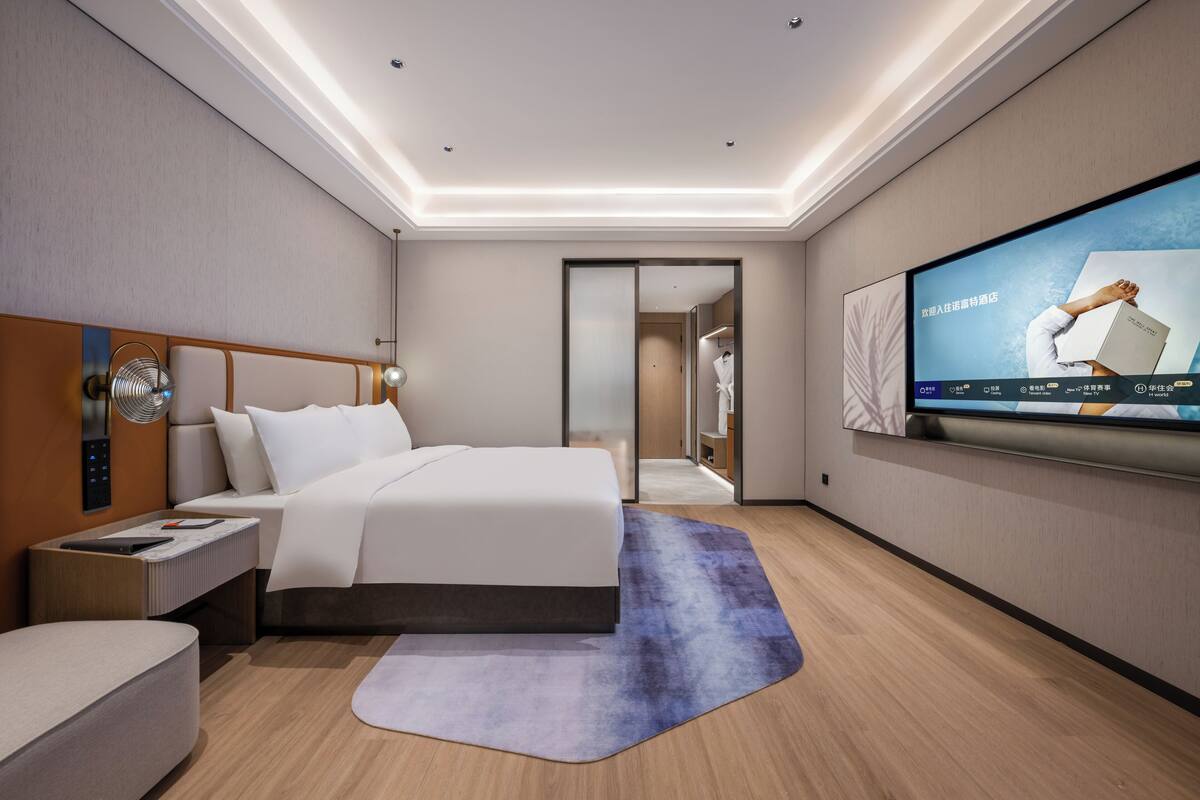Habitación ejecutiva, 1 cama King size | Edredón, minibar y caja de seguridad en la habitación