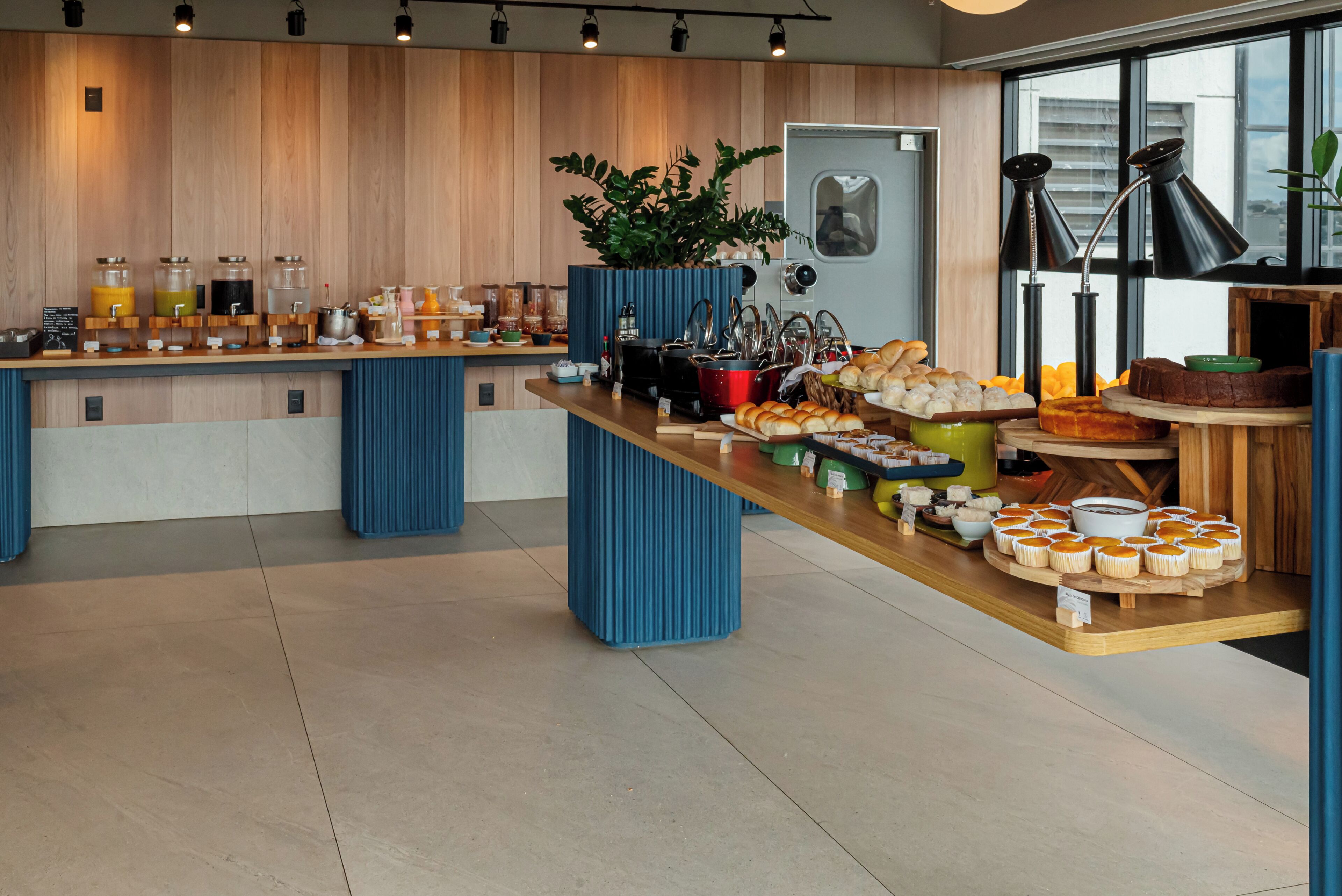 A breakfast buffet with various food items and a coffee station.