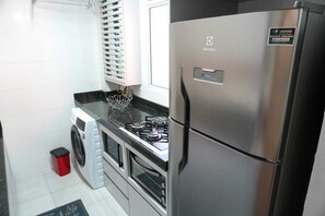Deluxe Apartment, Air conditioning | Private kitchen - elite house (Rio das Ostras)