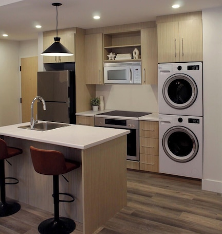 Microwave, dishwasher. Modern Uptown Gem AC, Gym, & Free Parking Near Saint Joseph’s hospital
