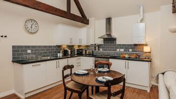 Microwave, oven, cookware/dishes/utensils, dining tables