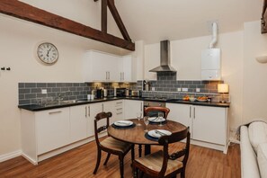 Microwave, oven, cookware/dishes/utensils, dining tables