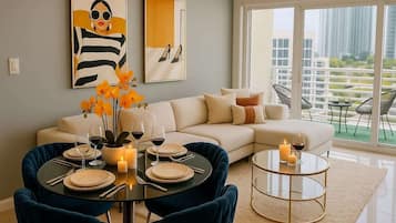 Condo, Balcony, City View | Living area | 50-inch plasma TV with cable channels