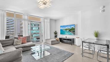 Condo, Balcony, City View | Living area | 50-inch plasma TV with cable channels