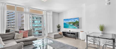 Condo, Balcony, City View | Living area | 50-inch plasma TV with cable channels