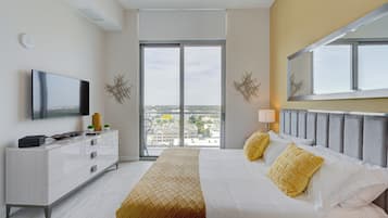 Deluxe Condo, Balcony, City View | Memory foam beds, in-room safe, desk, laptop workspace