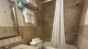 A bathroom with a sink, toilet, and bathtub. - STAY MORE, SPEND LESS (Kutztown)