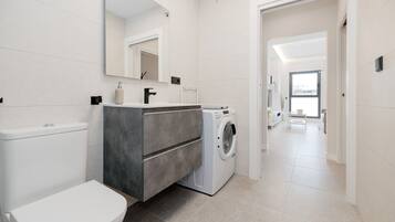 Shower, hair dryer, towels