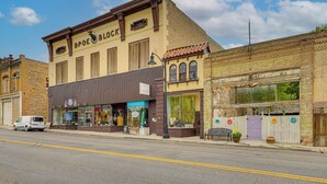 A street view with a building labeled "BPOE BLOCK" featuring a storefront with a sign for "The Great American Barbecue." - Eureka Main Street Retreat Near ATV Trails & Mines (Eureka)