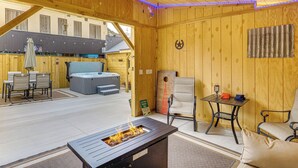 A wooden interior with a ceiling fan, a hot tub, and outdoor seating. - Eureka Main Street Retreat Near ATV Trails & Mines (Eureka)