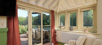 Luxury Waterfront Boathouse with Hot Tub, Private Garden & Alfresco Kitchen