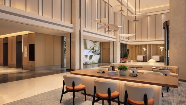 A modern hotel lobby with a reception desk, seating area, and large windows. - Hilton Garden Inn Zhengzhou Airport Aerotropolis (Zhengzhou)