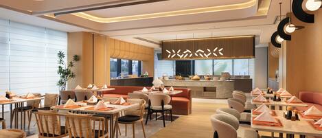 A modern restaurant with a central bar, multiple dining tables, and chairs.