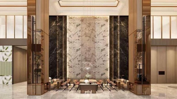 A spacious lobby with a central seating area, high ceilings, and a large decorative wall. - Hilton Garden Inn Shaoxing Yuecheng South (Shaoxing)
