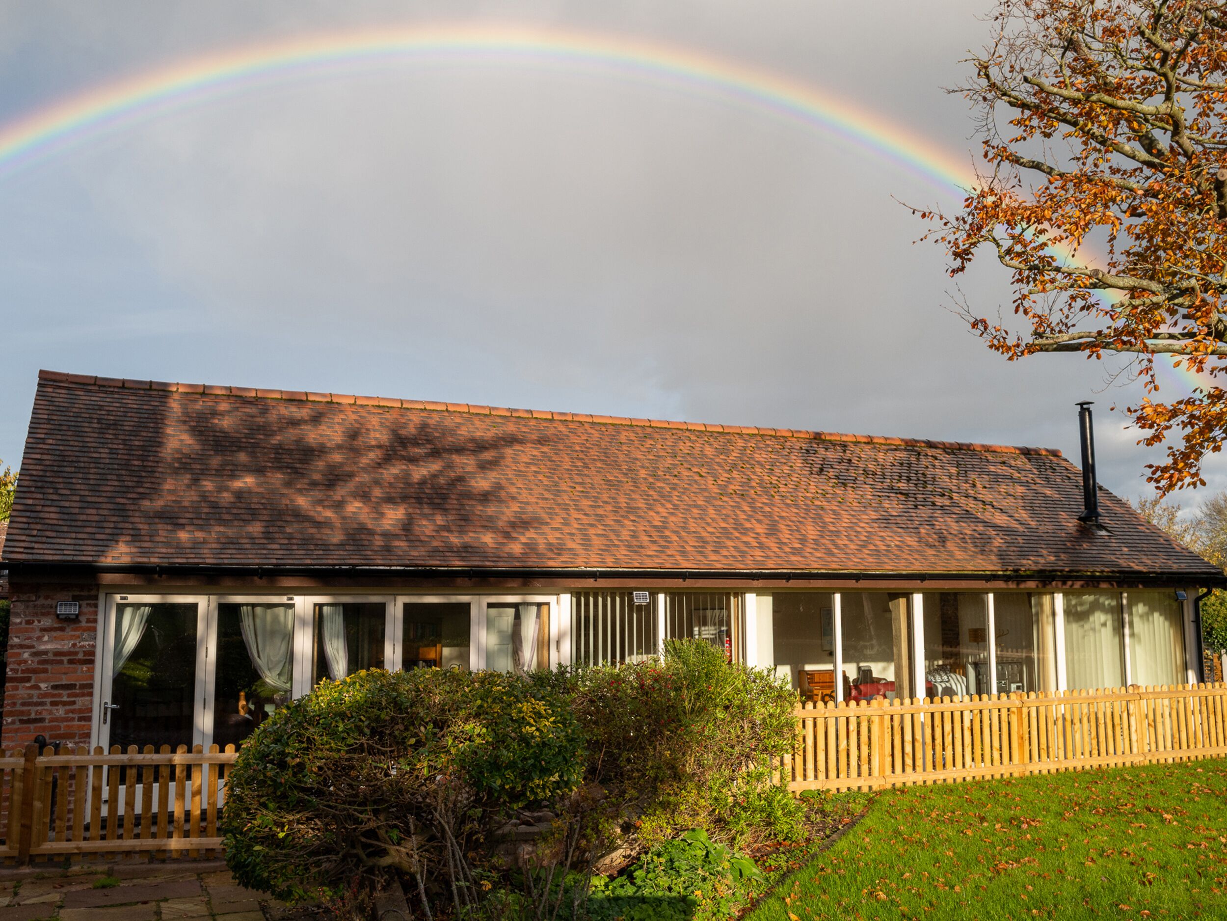 A two-story building with a brick facade and a tiled roof. - Nature's Lodge (Kidderminster)