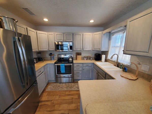 House, Multiple Beds, Patio, Garden View (Beach Cottage on C Street) | Private kitchen | Dining tables