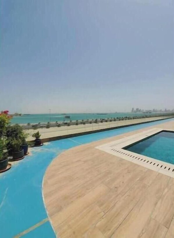 Pool - A Luxurious Sea View 1 Bedroom Apartment unit 4 (Al HIDD)