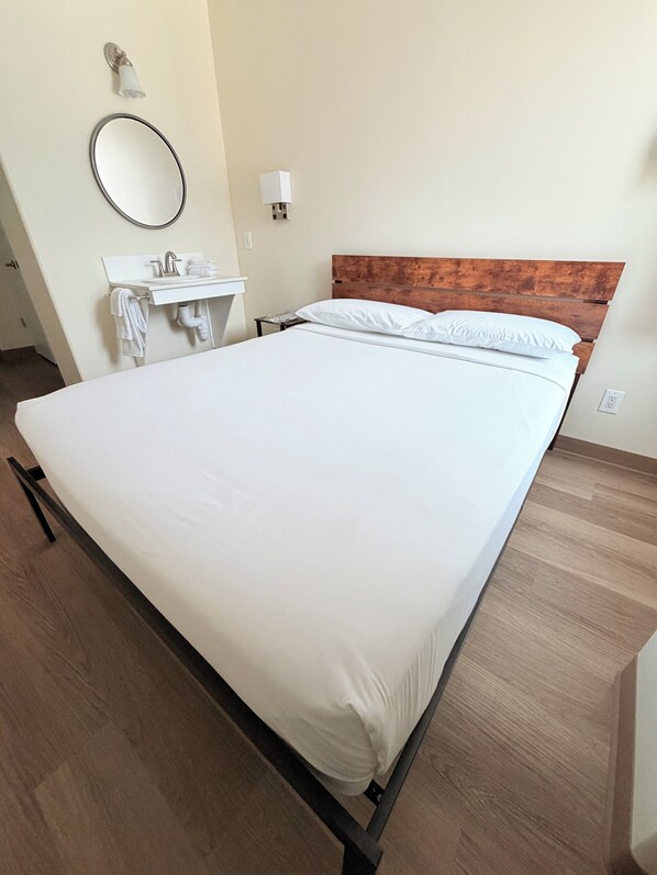 Premium bedding, down comforters, desk, laptop workspace