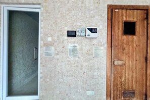 A door with a keypad lock, a peephole, and a small window. - Lot 163 By ZenGlo (Kuala Lumpur)