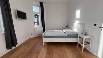 1 dormitorio, caja fuerte, tabla de planchar con plancha y wifi