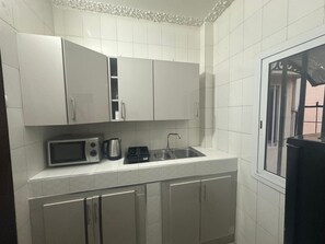 Fridge, microwave, oven, cookware/dishes/utensils