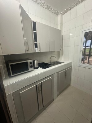 Fridge, microwave, oven, cookware/dishes/utensils