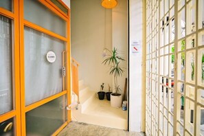 A hotel entrance with a closed door, a potted plant, and a sign indicating the hotel is closed. - Swing & Pillows @ Armenian Victoria , Georgetown Penang (George Town)