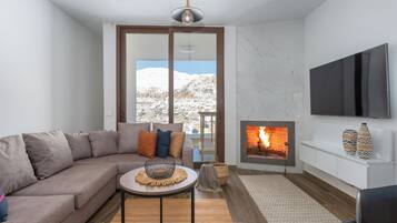 Apartamento, 1 cama de casal, cozinha americana, vista para a montanha | Sala de estar