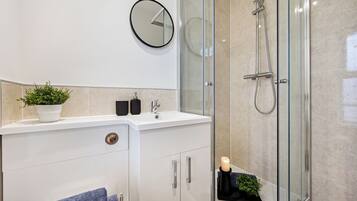 Shower, hair dryer, towels, soap