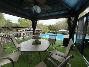 Outdoor dining - Charming 2-bedroom country mobile home with game room, hot tub, seasonal pool (Fredericktown)