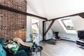 Apartment, Air conditioning, City View | Living area | Flat-screen TV