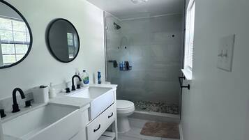 Shower, towels, soap, toilet paper