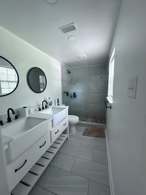 Shower, towels, soap, toilet paper