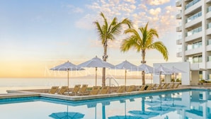 Outdoor pool, a heated pool - Moikkarentals | Beachfront 1BR Harbor171-N1702 PV (Puerto Vallarta)