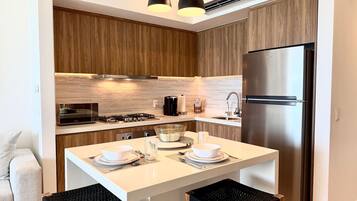 Coffee/tea maker, fridge, microwave, oven
