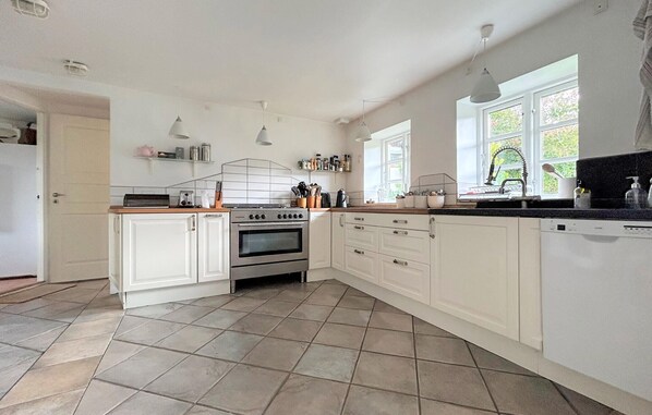 Fridge, stovetop, dishwasher, coffee/tea maker