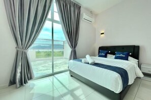 A hotel room with a large bed, grey curtains, a view of the outdoors, and an air conditioning unit. - Langkawi Cozy Holiday Home at Taman Simfoni by Zervin (Langkawi)