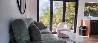 Secluded Modern Cabin with Bluff Views, Hot Tub, Fire Pit.