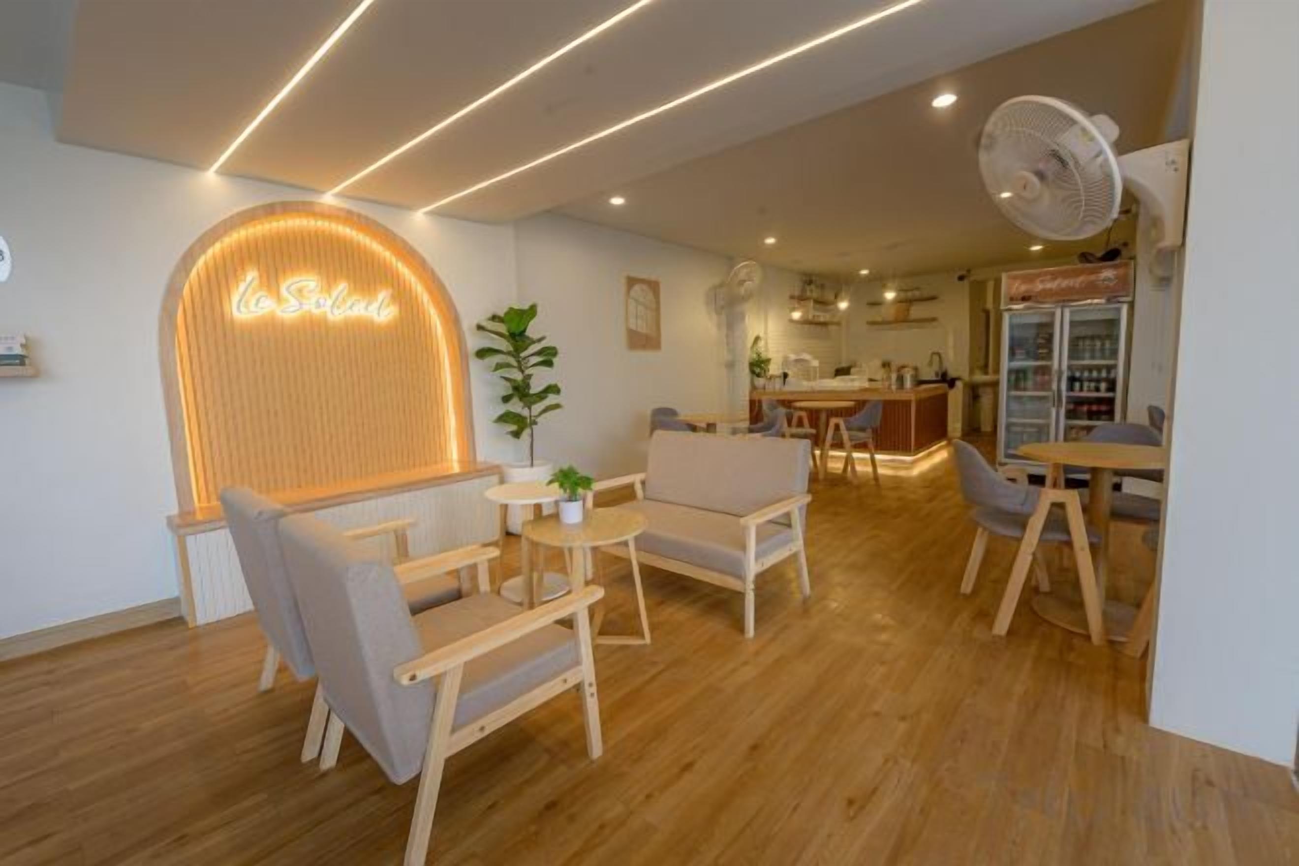 A modern interior with a seating area, a kitchen, and a bar area.