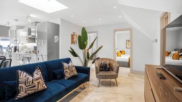 Superior Apartment | Living area | 32-inch Smart TV with digital channels, Netflix, streaming services