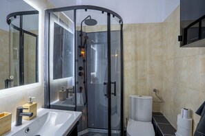 Shower, hair dryer, towels, soap