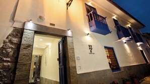 A building with a stone facade, a blue window, and a sign reading "TORITOS". - 7 Toritos Boutique Hotel (Cusco)