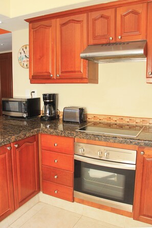 Comfort Apartment | Private kitchen | Full-size fridge, microwave, stovetop, coffee/tea maker