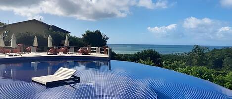 Deluxe Bungalow | Pool | Outdoor pool, open 8:00 AM to 6:00 PM, pool umbrellas, sun loungers